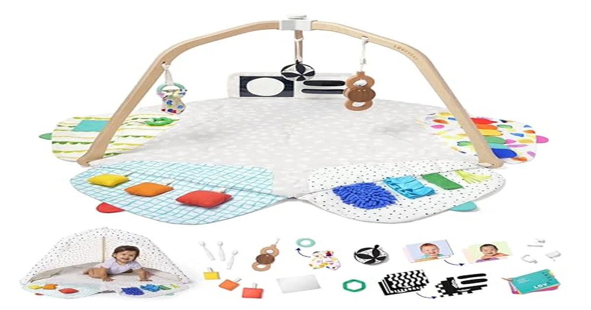 Colorful baby play mat with hanging toys on a soft nursery floor