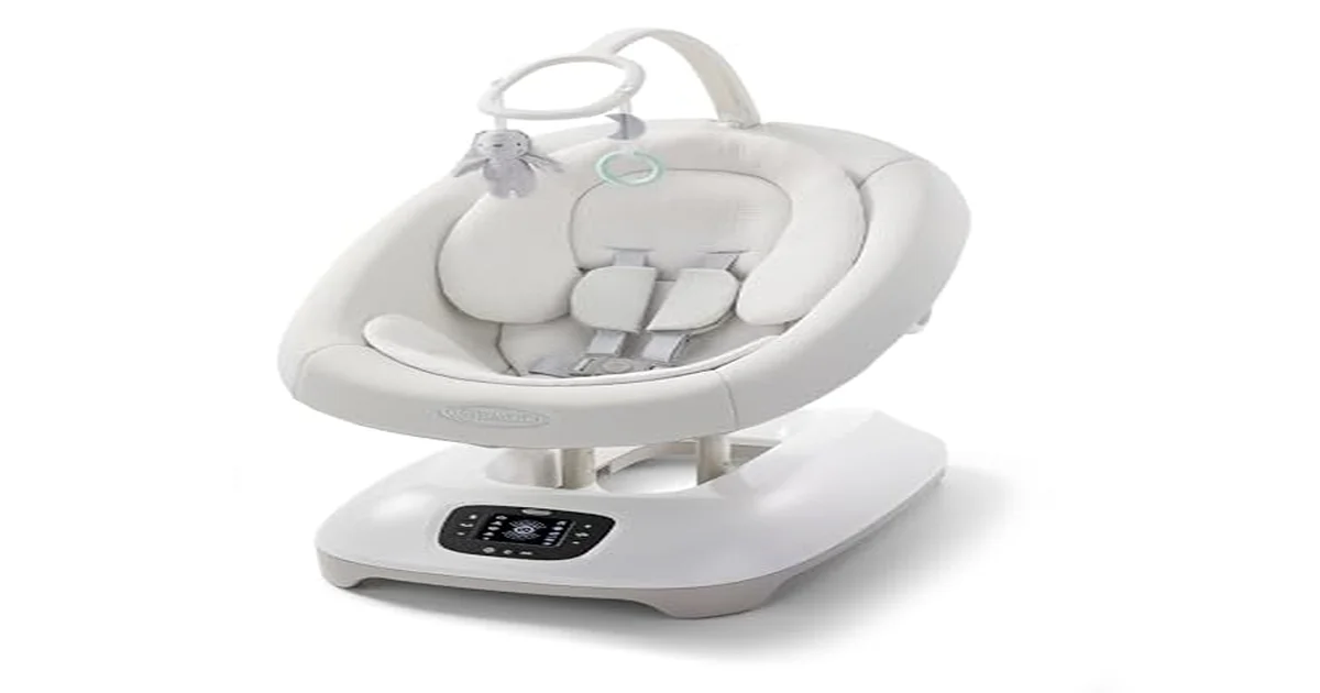 Baby sleeping peacefully in a modern baby swing in a bright nursery