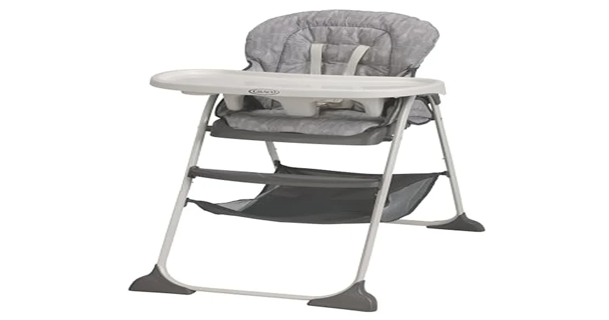 Baby sitting happily in a modern high chair during mealtime