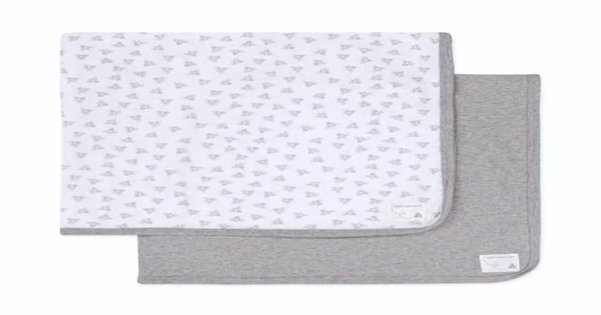 Eco-friendly baby products arranged on natural wood surface