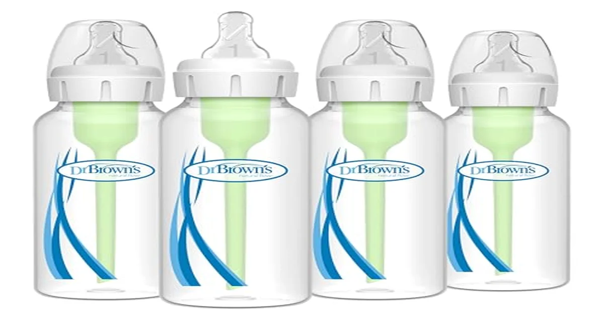 Parent pace bottle feeding a breastfed baby in an upright position